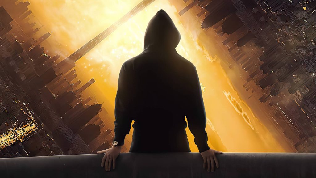Solitary figure in black hoodie overlooking inverted cityscape glowing with warm amber light Wallpaper