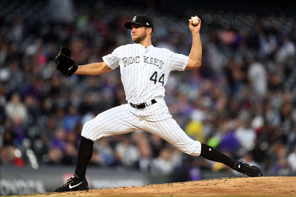 Tyler Anderson pitching for Colorado Rockies in classic pinstriped uniform on baseball mound Wallpaper