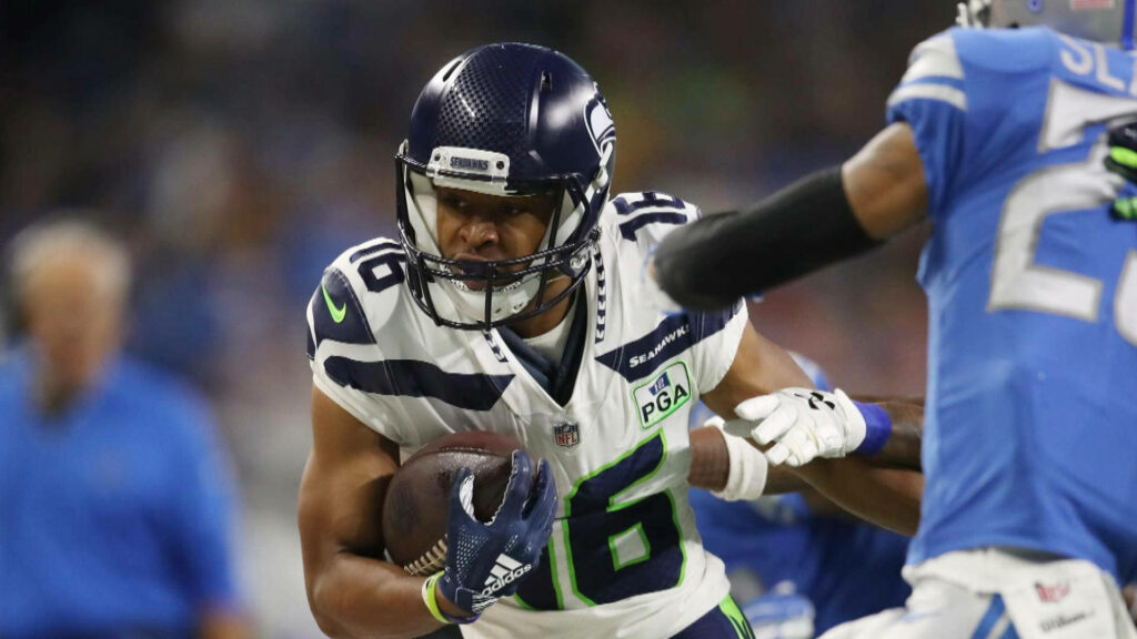 Tyler Lockett Seattle Seahawks football action versus Detroit Lions vivid colors stadium lights Wallpaper