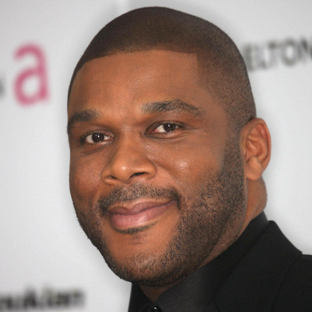 Tyler Perry portrait with calm confident smile on soft blurred background wallpaper