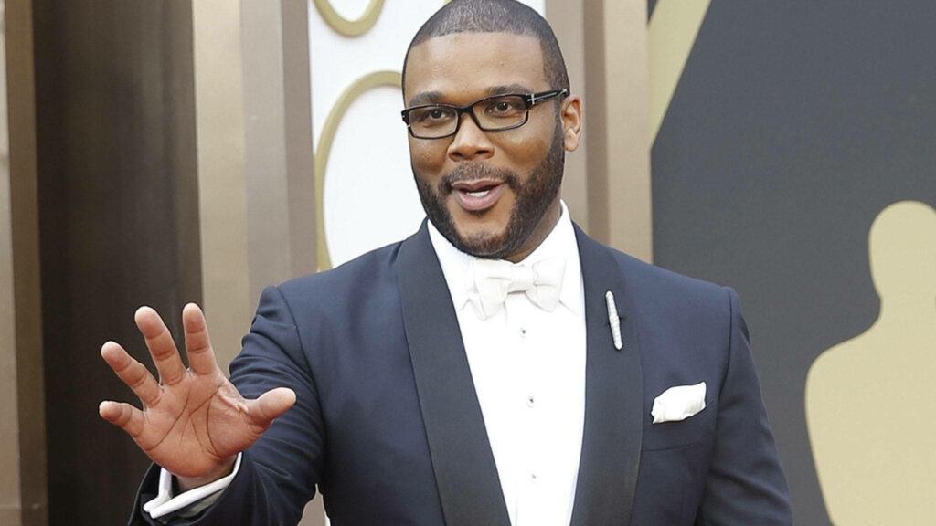Tyler Perry in sharp tuxedo waving warmly friendly welcoming wallpaper background image