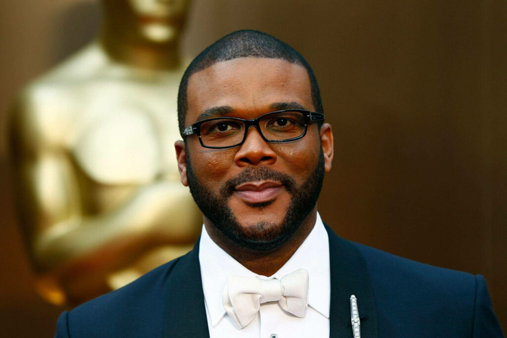 Tyler Perry in formal suit with bow tie representing top 5 richest actors wallpaper background