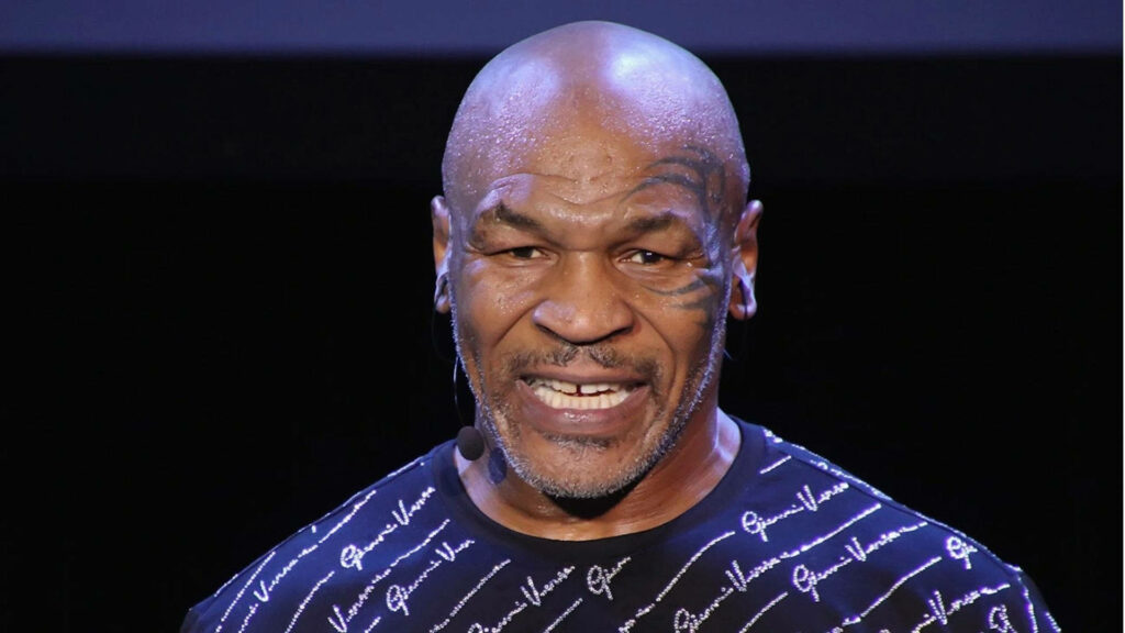 The Powerful Voice of Mike Tyson: Captivating the Audience in Midnight Blue Wallpaper