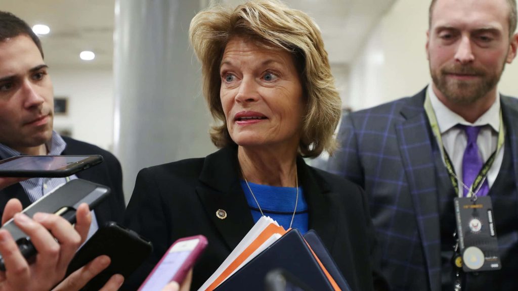 U.S. Senator Lisa Murkowski speaks to media on Capitol Hill in black blazer and blue top Wallpaper