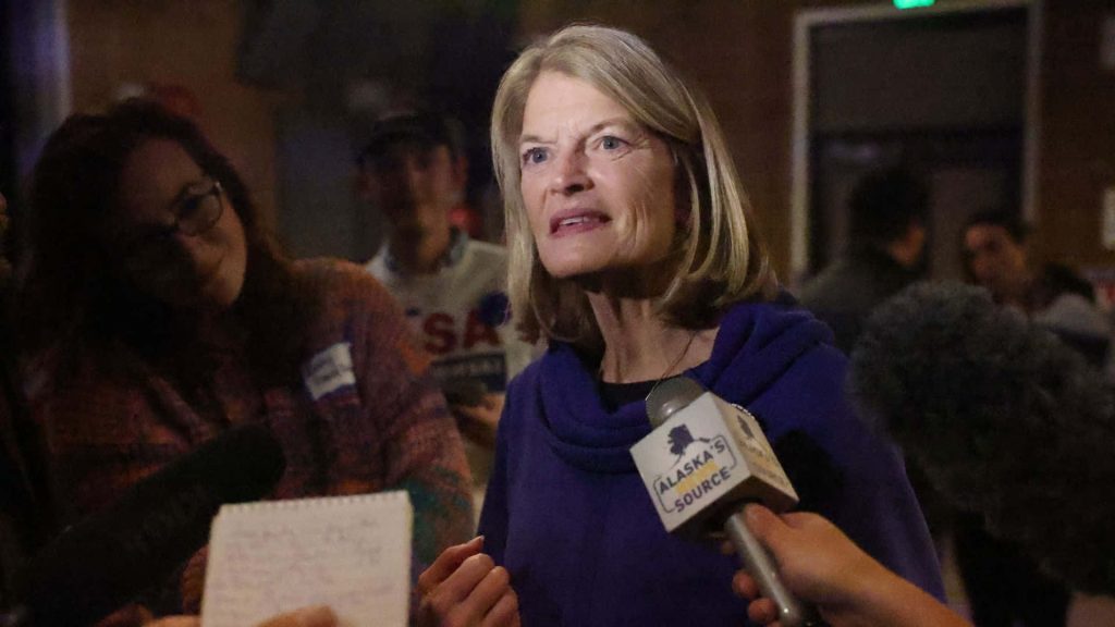 U.S. Senator Lisa Murkowski speaks to reporters in dark blue top during Alaska news interview Wallpaper