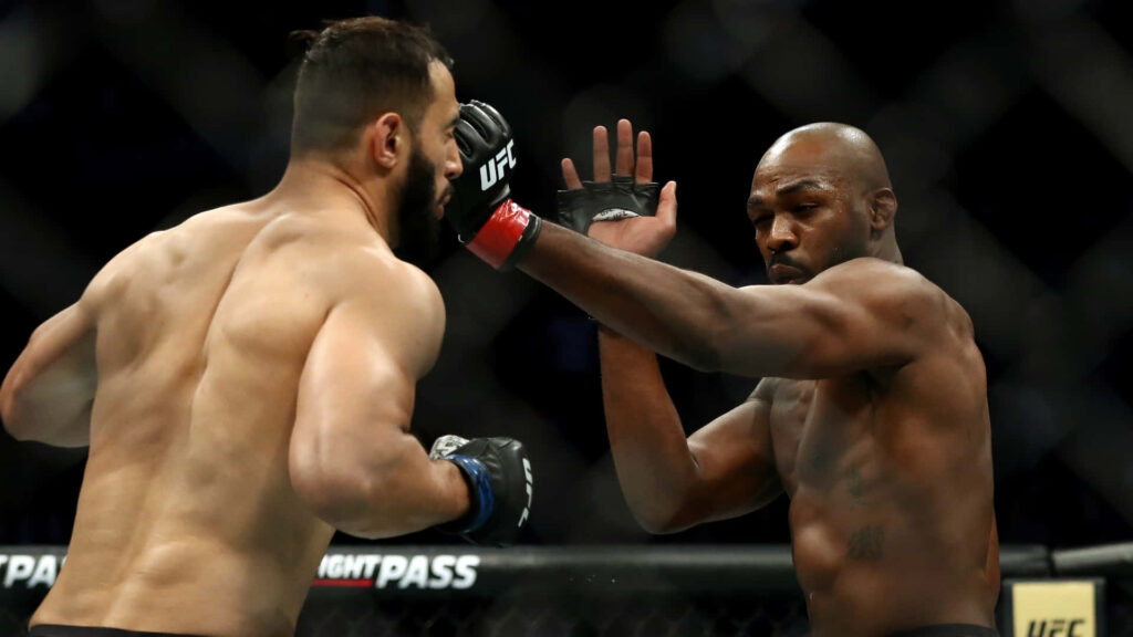 Jon Jones vs Dominick Reyes UFC 247 main event intense action inside octagon MMA wallpaper background