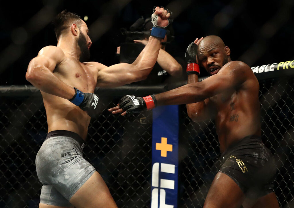 UFC 247 Light Heavyweight Championship Jon Jones vs Dominick Reyes intense fight action wallpaper