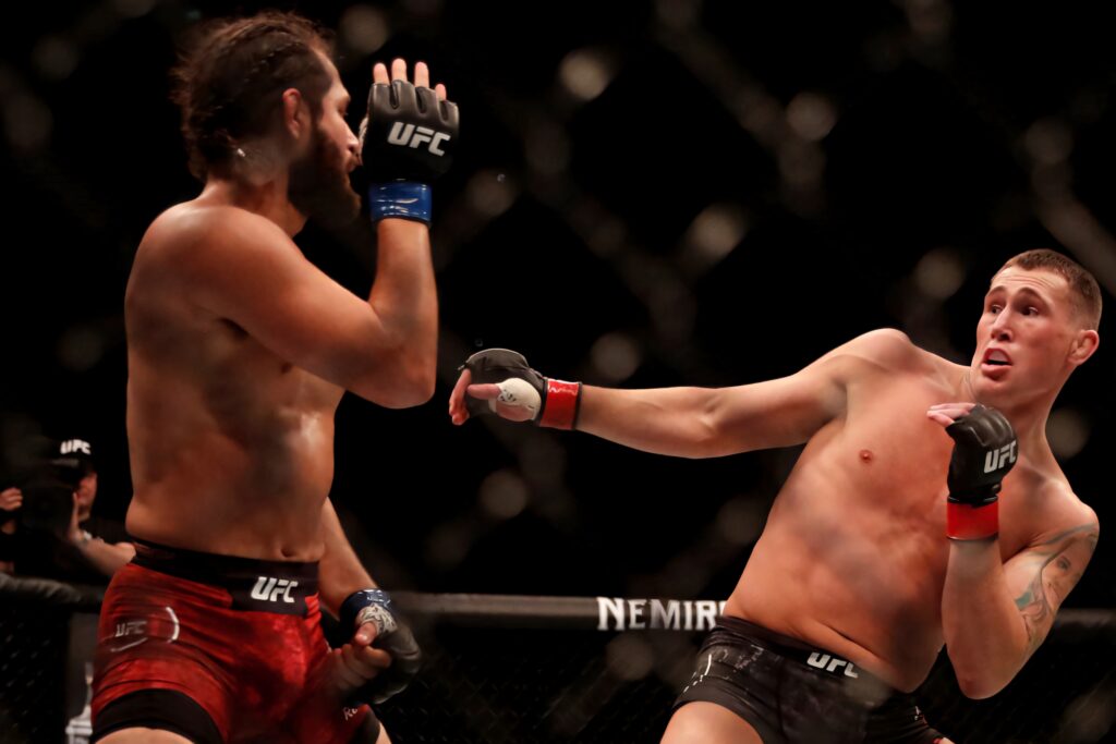 Jorge Masvidal vs Darren Till UFC London intense fight dynamic kick in octagon wallpaper background