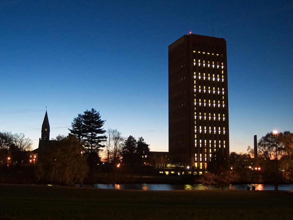 UMass Amherst Central Area dusk with illuminated WEB Du Bois Library and twilight sky wallpaper