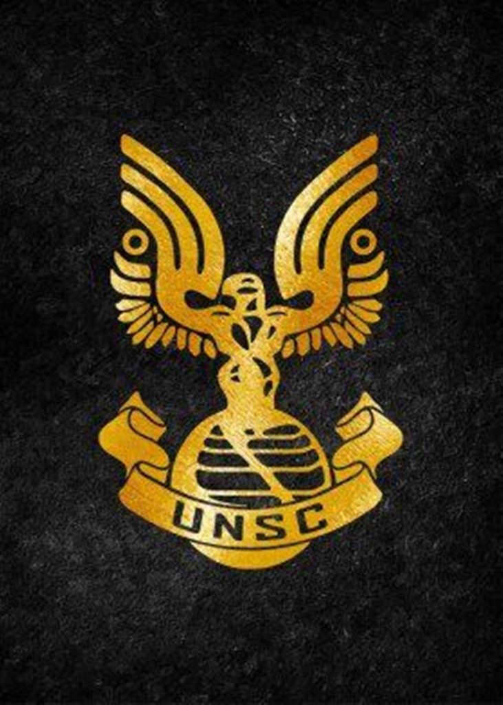 Metallic gold UNSC logo on dark rugged background Halo franchise military wallpaper design