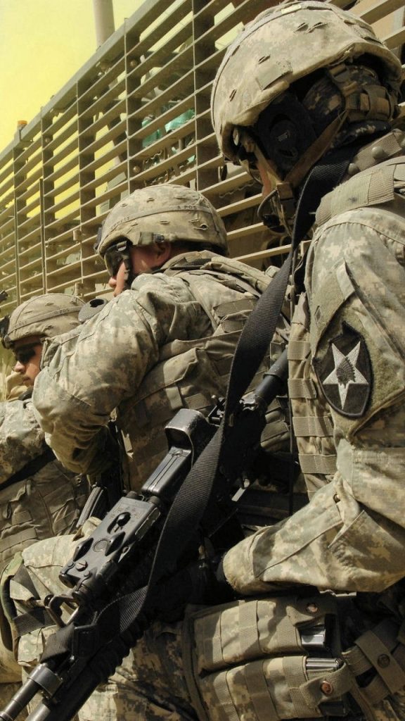 US Army 2nd Infantry Division soldiers in ACU gear mid-mission inside transport vehicle wallpaper