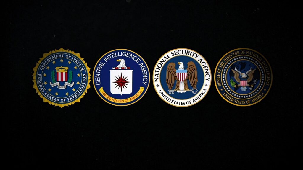 Wallpaper showing official seals of CIA FBI NSA and ODNI on dark textured background