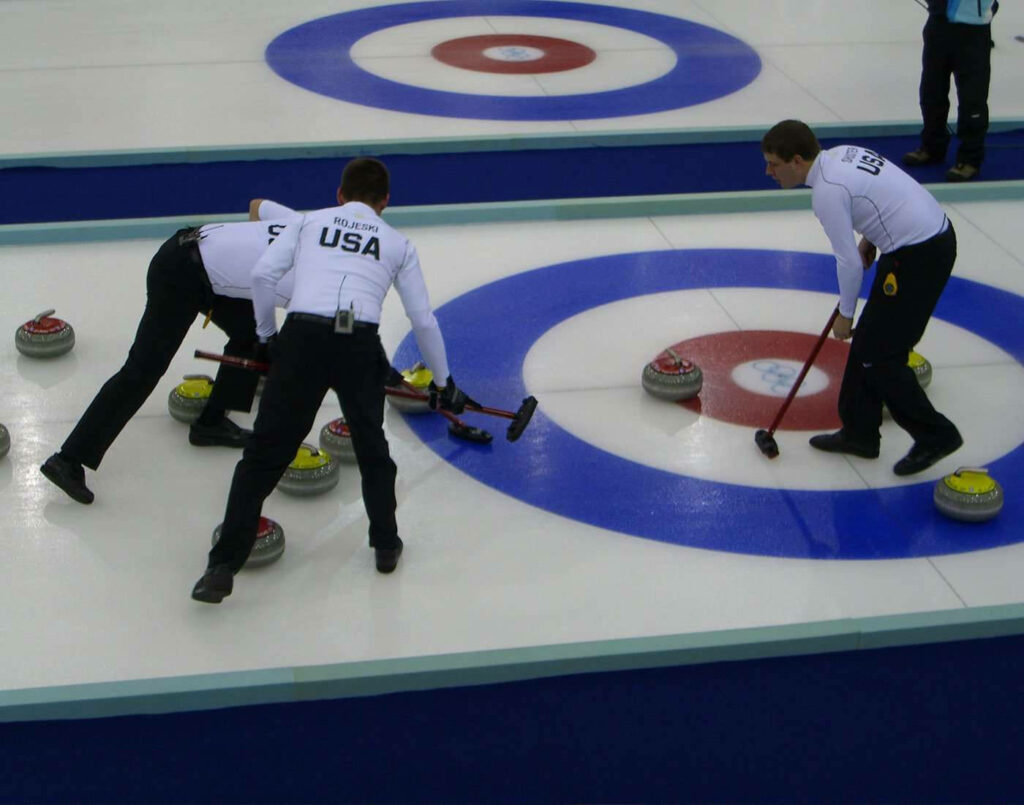 USA Curling Team in Action: Intense Game Wallpaper Background