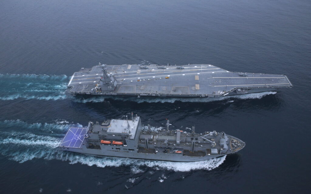 Glorious USS Gerald R Ford: Majestic HD Wallpaper of the US Navy's Mighty Nuclear Aircraft Carrier and its Armada of Warships