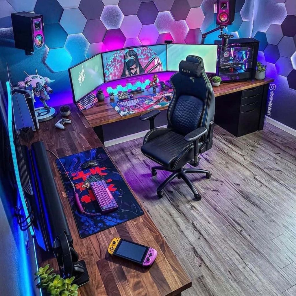 High-end gaming setup with Razer chair triple monitors RGB lighting and neon wood desk wall panels Wallpaper