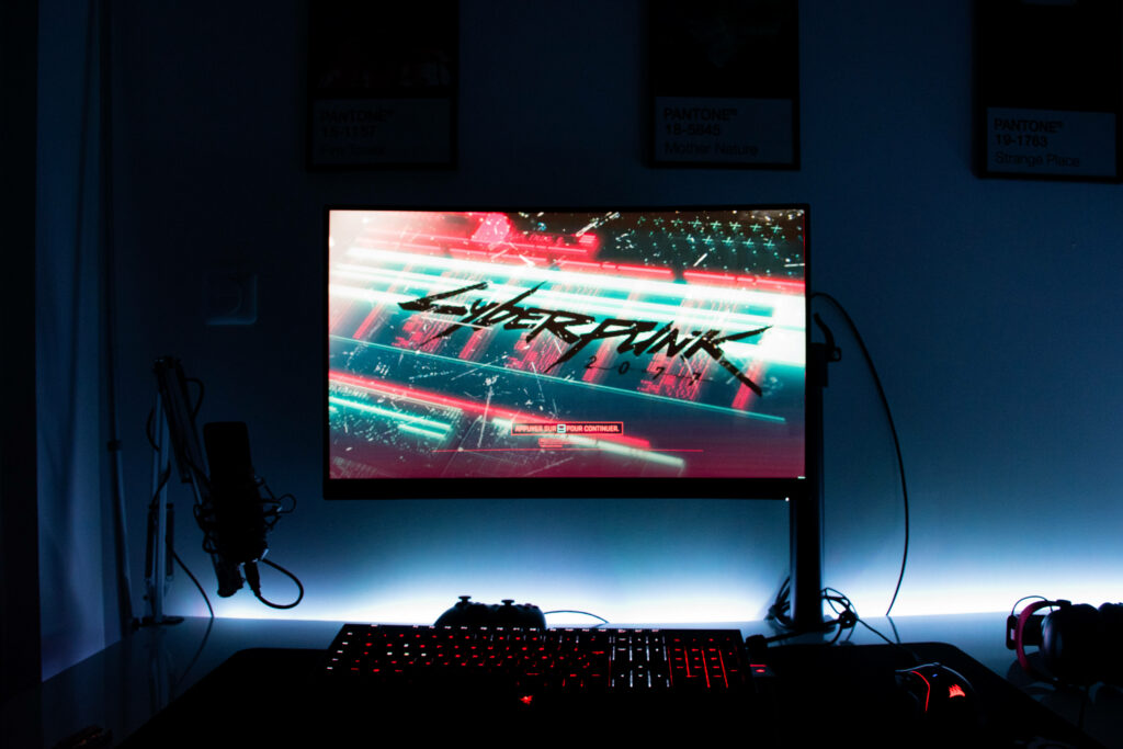 Power-Packed Gamer's Sanctuary: Captivating Image of an Exquisite Gaming Setup with High-Res Monitor, Illuminated Keyboard and Mouse Wallpaper