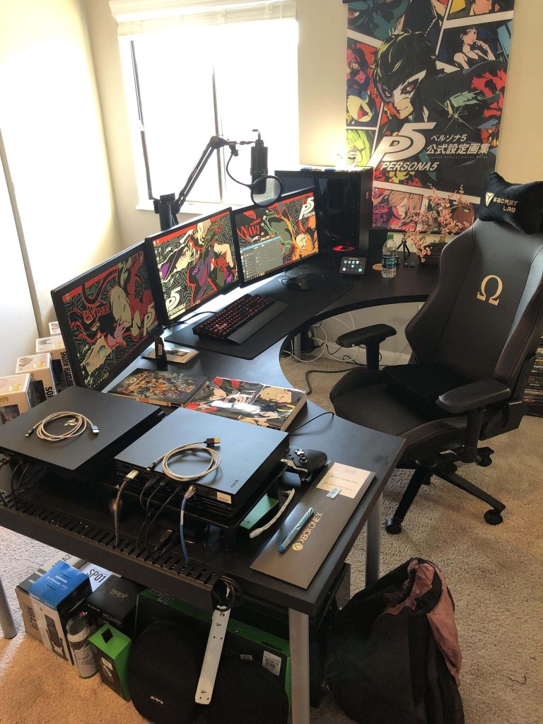 Gaming room with triple monitors showing Persona 5 wallpapers and Secretlab Omega chair setup