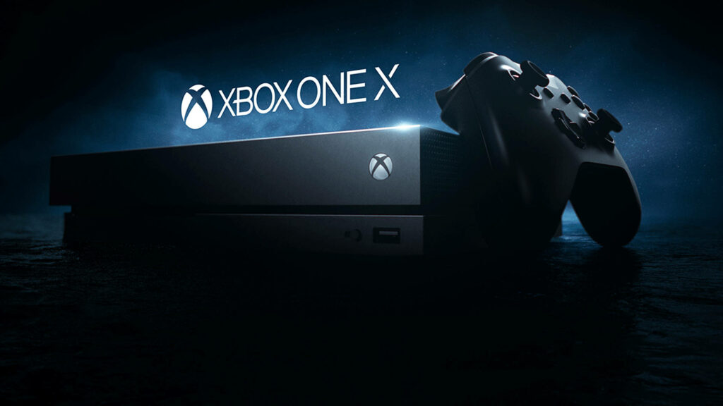 Xbox One X Console and its Sleek Controller in a Captivating Background Wallpaper