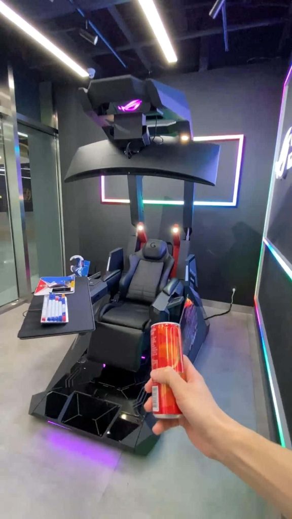POV view of sleek ROG gaming cockpit with RGB lighting keyboard and energy drink setup Wallpaper