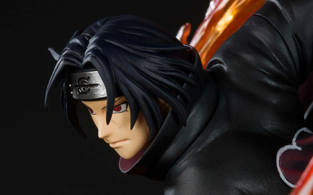 Itachi Uchiha action figure with Sharingan eyes Akatsuki cloak and dramatic flame effects wallpaper