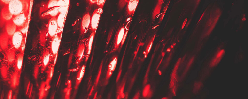 Stunning Textured Metal Wallpaper with Red Light & Bokeh Background
