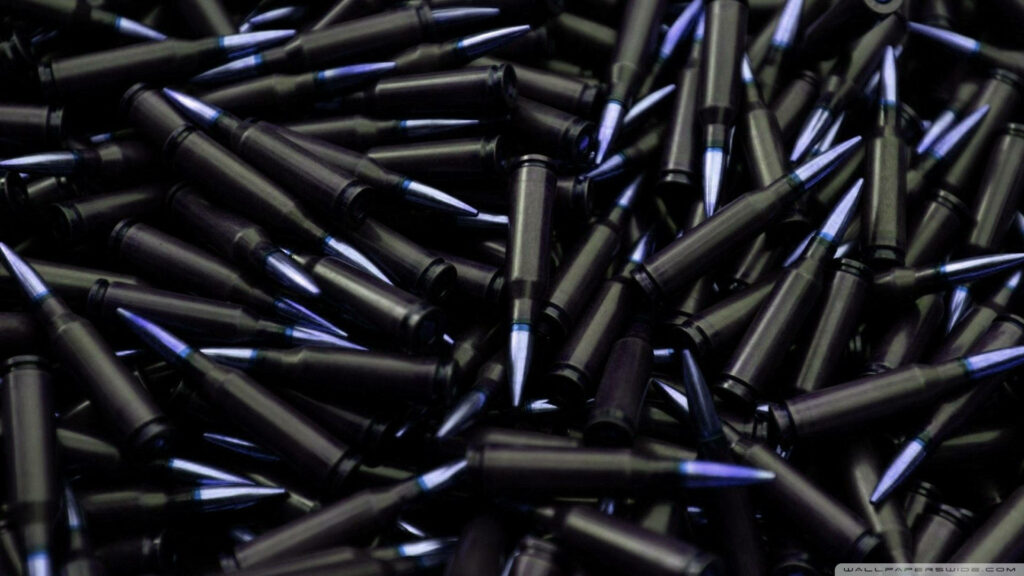 Dark purple bullet stacks with intense purple haze creating a mysterious metallic wallpaper background
