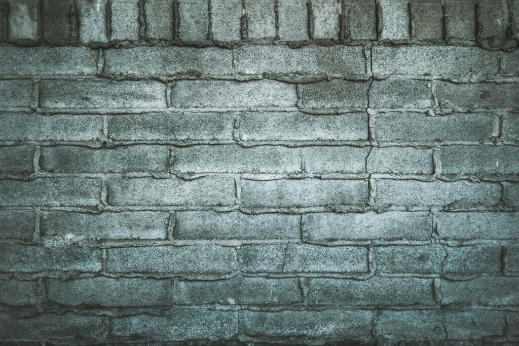 Patterned Texture: Exploring the Unusual Shiny Gray Brick Wallpaper