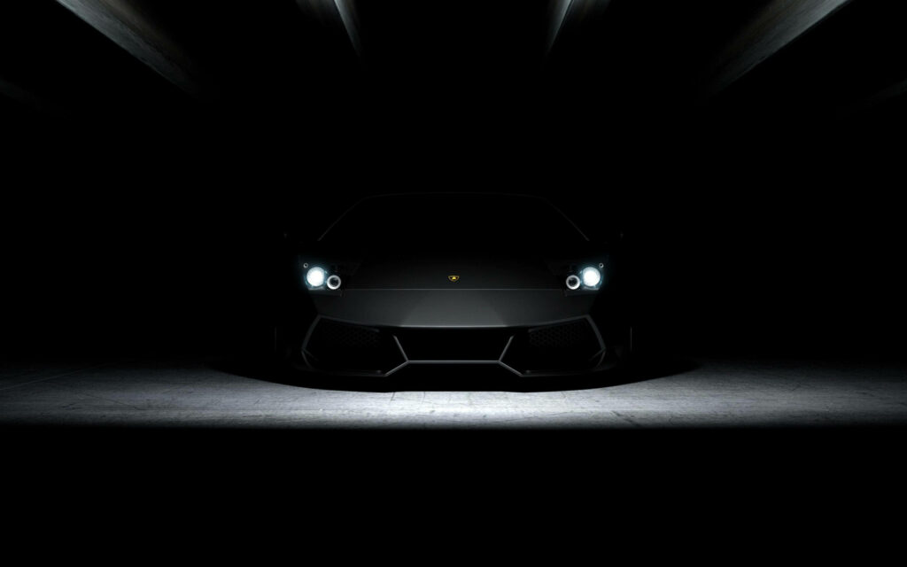 Stealthy Beast: Capturing the Pure Elegance of a Black Lamborghini in the Shadows Wallpaper