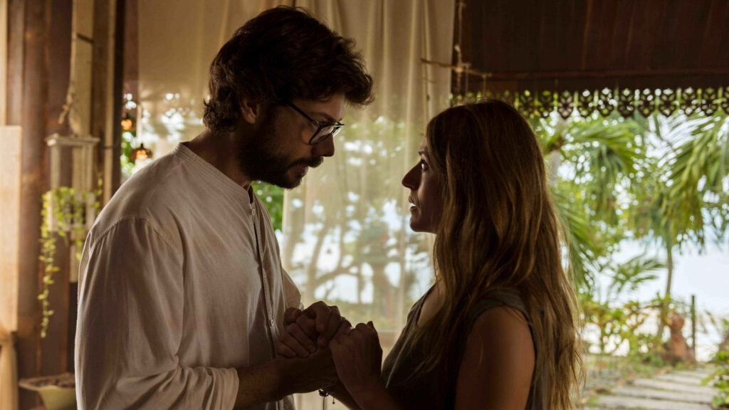 Amidst Tropical Paradise: Professor and Raquel of Money Heist Embrace Their Love
or
Tropical Love: Professor and Raquel from Money Heist Open Their Hearts in Paradise Wallpaper