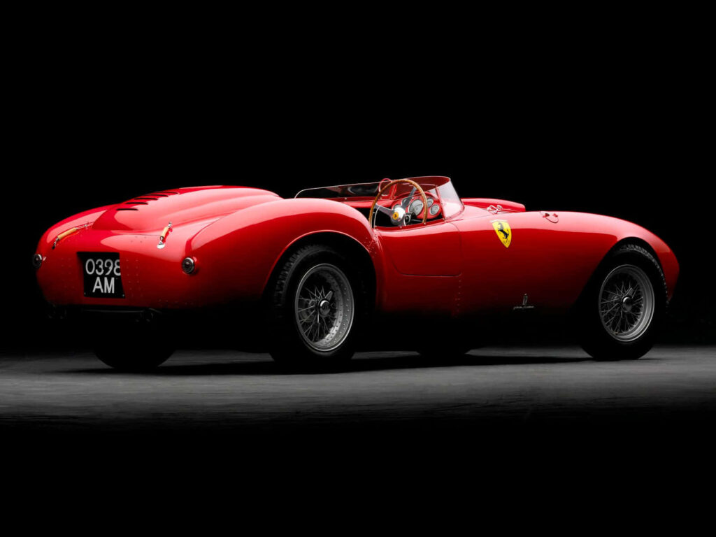 Unleash Your Inner Speed Demon with a Timeless Journey in this Iconic Red Ferrari Wallpaper