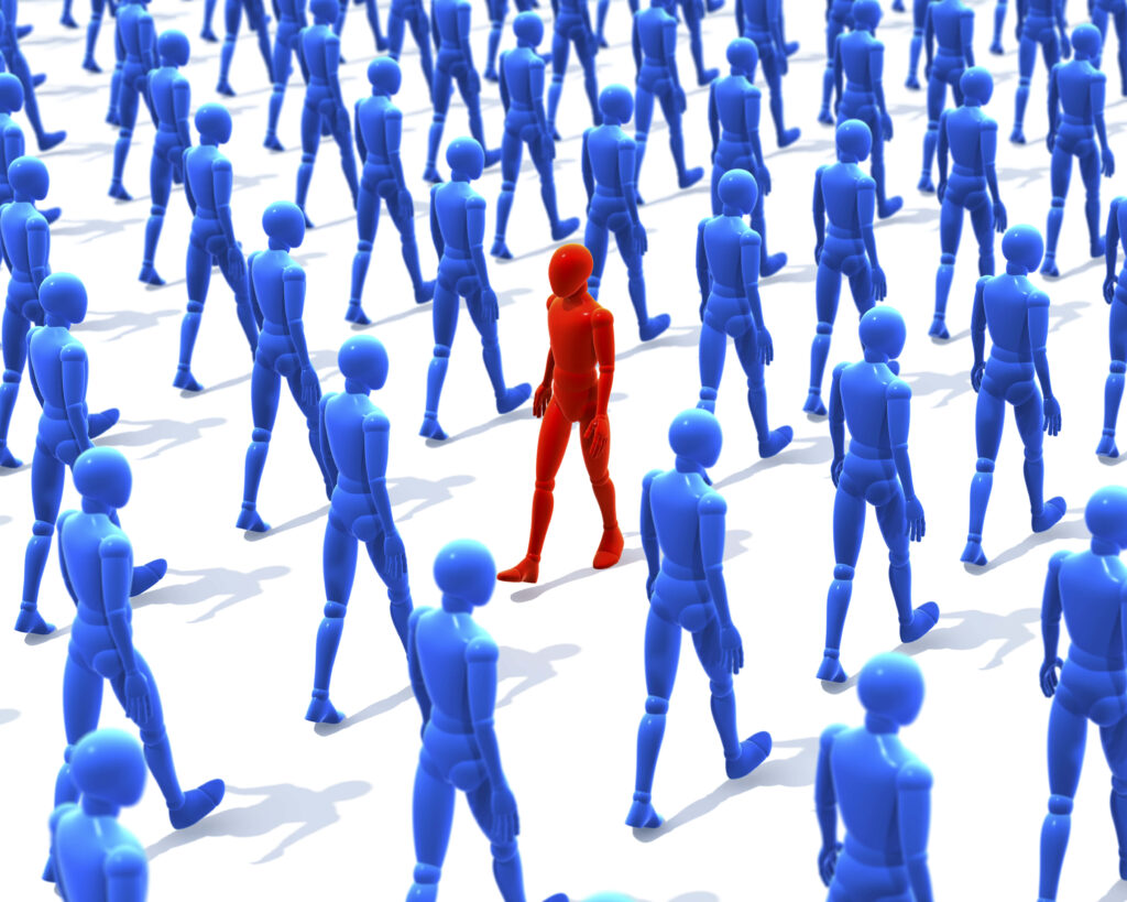 Unique Red Figure in Blue Crowd: Symbol of Individuality & Distinction Wallpaper