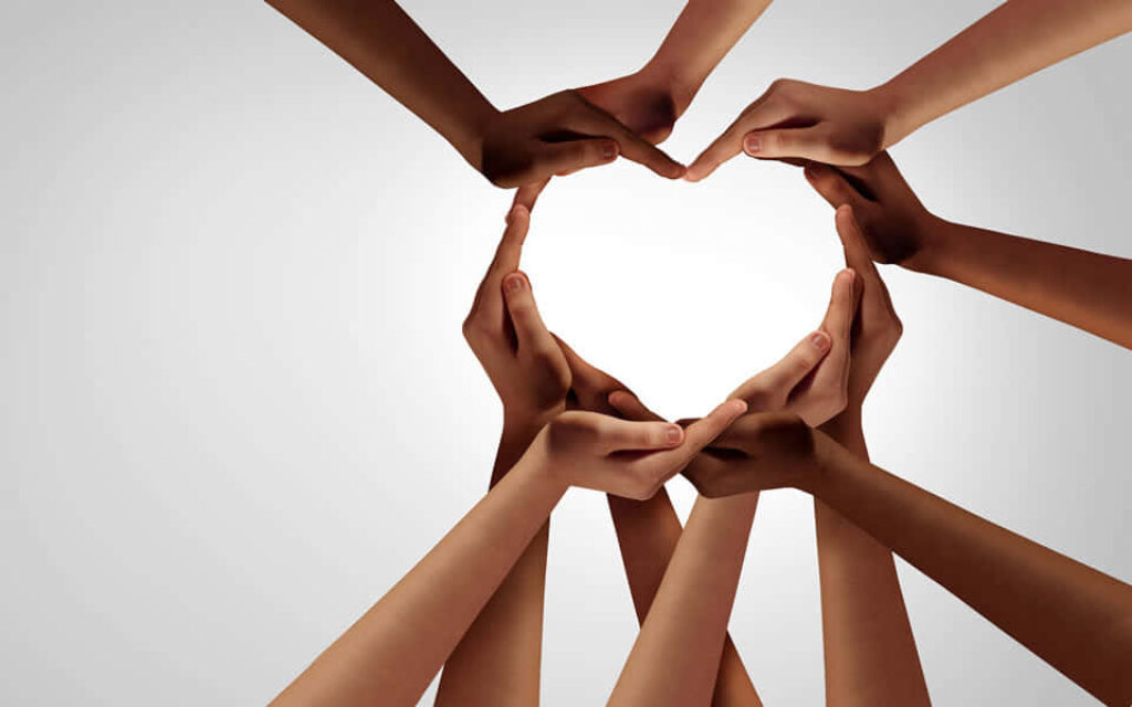 Unity in Diversity: Heart-Shaped Hands Wallpaper Background