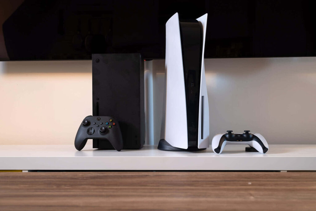 Xbox and Controller Near a TV Background Wallpaper