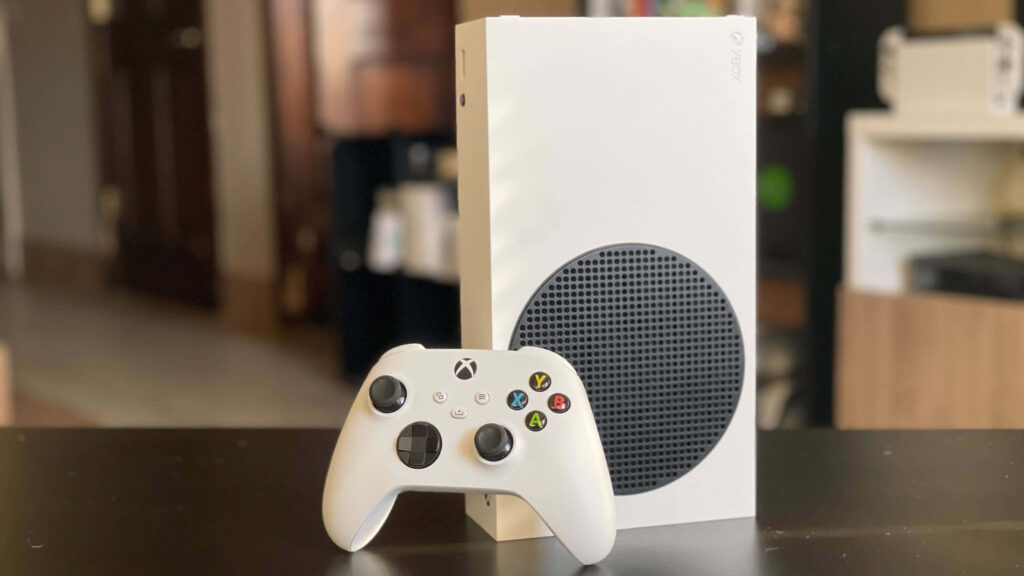 White Xbox and Controller on a Table Background Wallpaper
