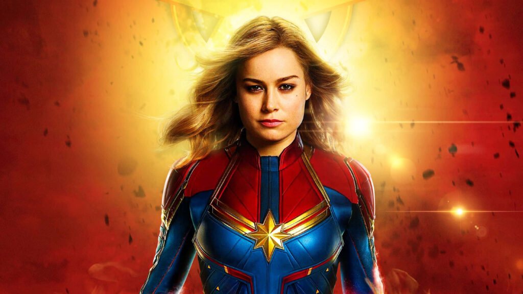 Marvelous Cosmos: Witness Captain Marvel's Heroic Journey through the Galaxy! Wallpaper