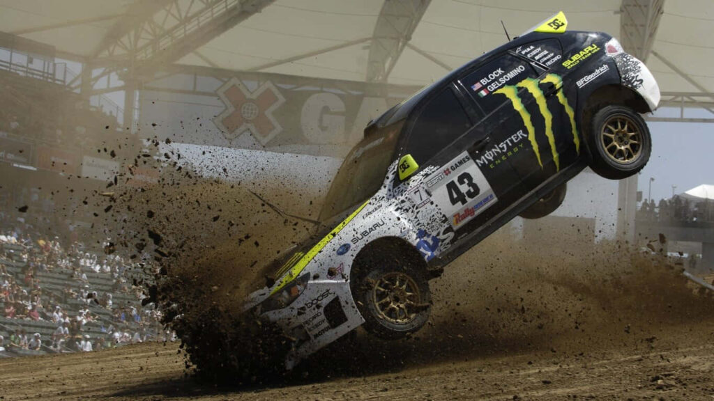 Dynamic rally car kicking up dust at dirt track - adrenaline-pumping wallpaper