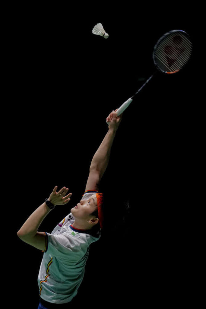 Badminton Player in Dark Background Wallpaper