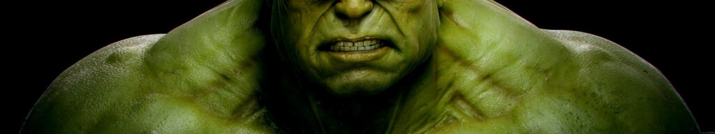 Immerse Yourself in Unstoppable Gaming and Entertainment with a Hulk-Sized Triple Monitor Setup Wallpaper