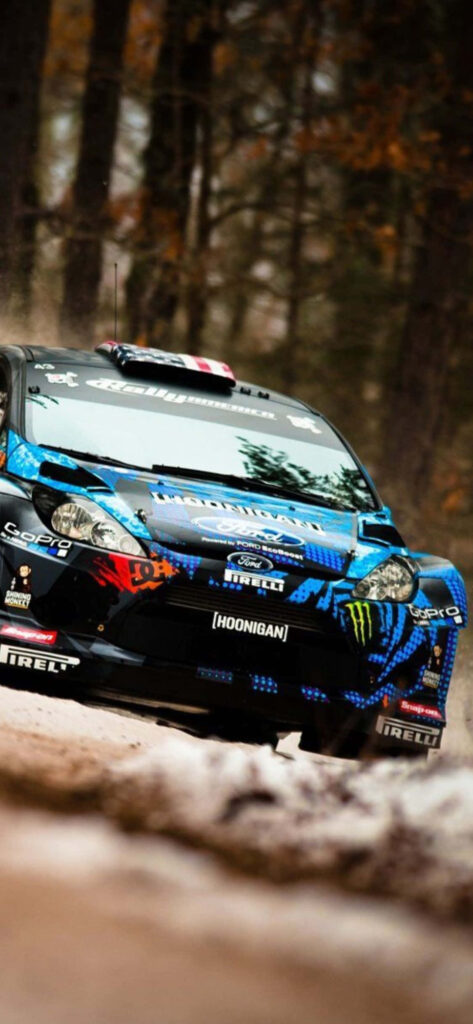 Hoonigan Rally Car Drifting in Dirt Track with Pirelli Livery Wallpaper