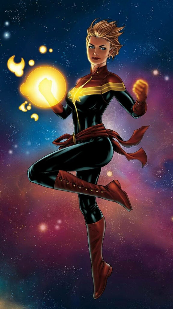 Radiant Carol Danvers beams with confidence, soaring majestically as Captain Marvel in this awe-inspiring photo Wallpaper