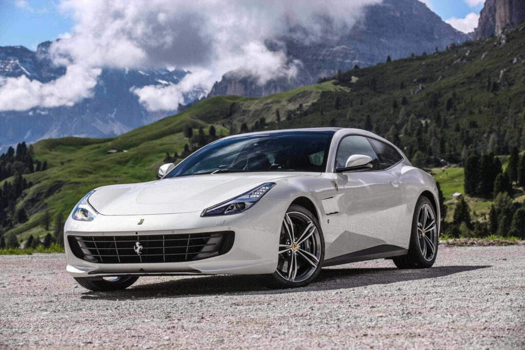 White Ferrari GTC4Lusso Against a Mountains Background Wallpaper
