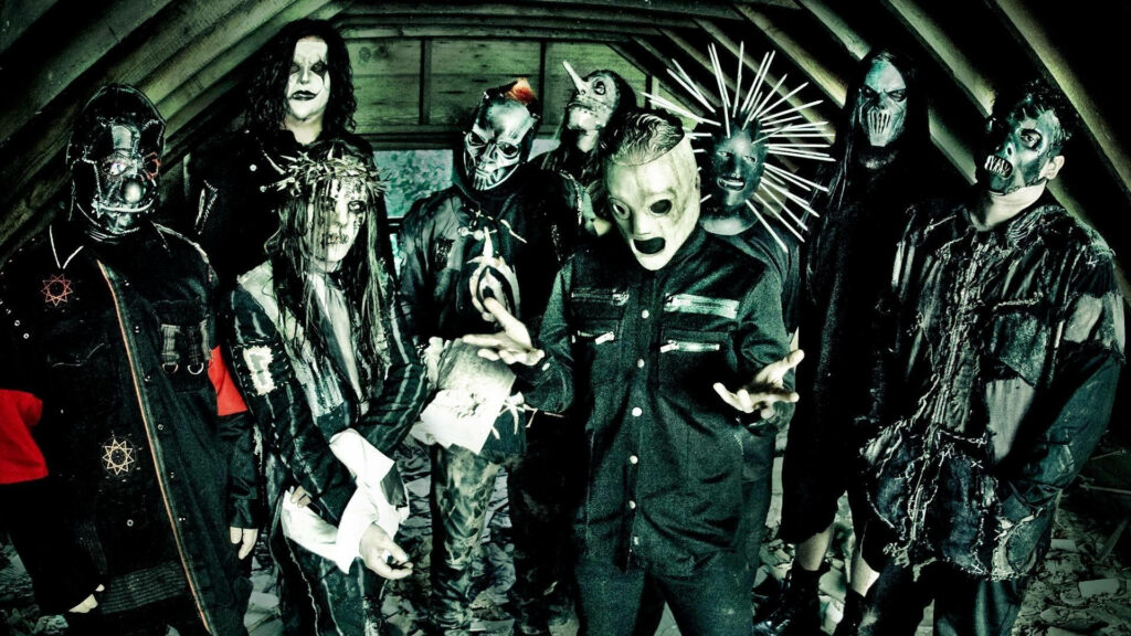 Unleashing Chaos: Nine Slipknot Members Conquer The Attic in Full Gear Wallpaper