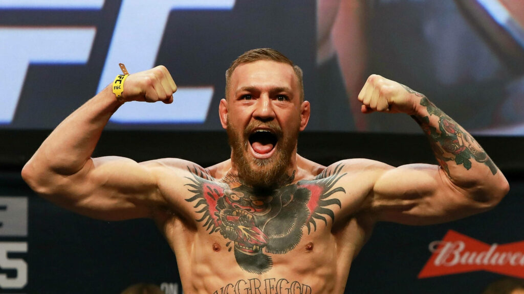 The Notorious One Unleashed: Conor McGregor's Epic Muscle Flexing Moment Wallpaper