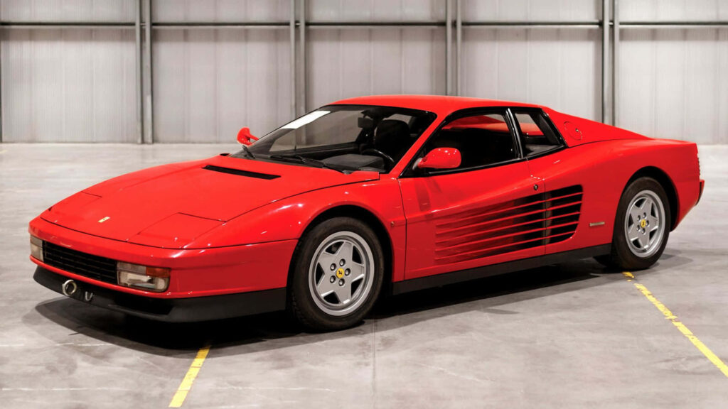 Passion Unleashed: The Stunning Performance and Elegance of a Red Ferrari Testarossa on an Open Road - A Captivating Wallpaper for Car Enthusiasts and Testarossa Admirers!
