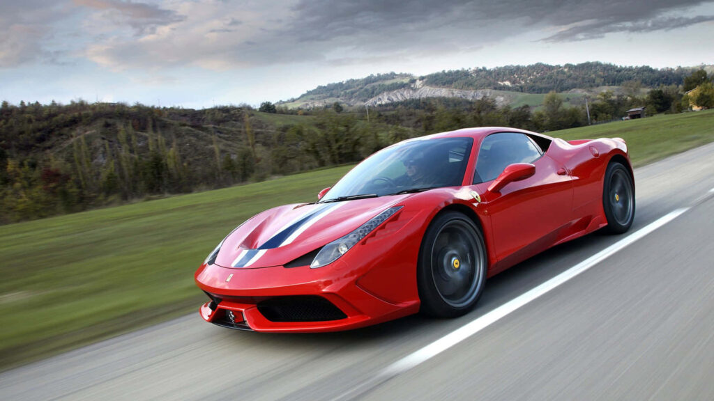 The epitome of speed and beauty: Unleashing the fiery potential of the Ferrari 458 Speciale on the race track! Wallpaper