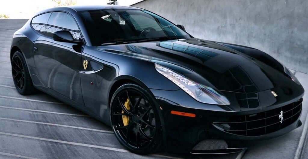 Black Ferrari FF Sports Car on a Road Background Wallpaper