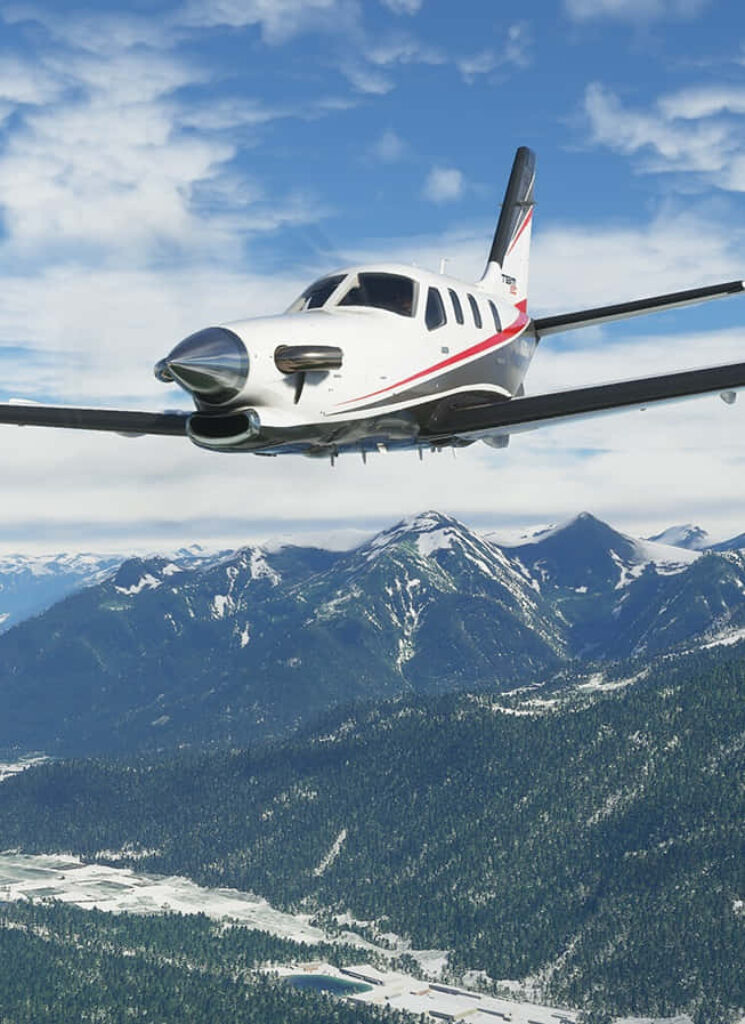 High-res Microsoft Flight Simulator wallpaper: propeller plane flying over mountains