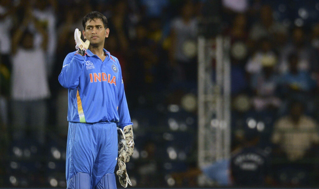 Cool Blue: Powerhouse Batter MS Dhoni in Indian Cricket Attire Wallpaper