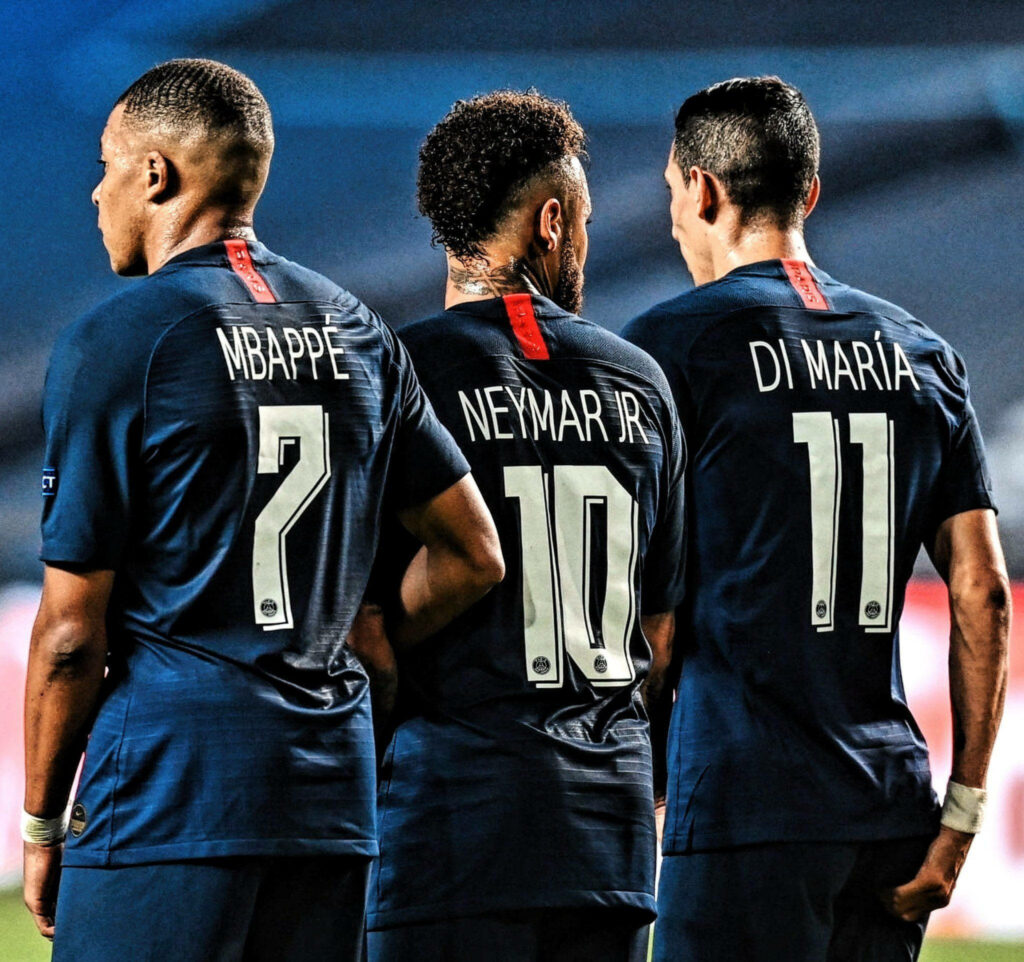 Dynamic Trio Revealed: Neymar, Mbappe, and Di Maria Sporting PSG Blue Jerseys with Names and Numbers Unveiled Wallpaper