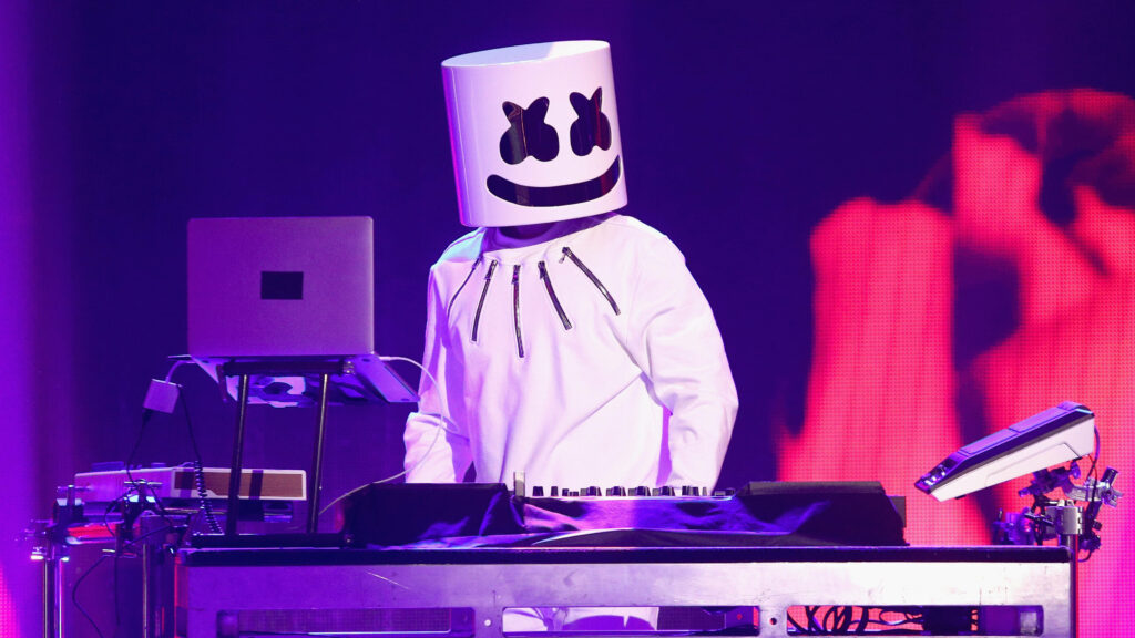 Pulsating Purple Spectacle: Captivating 4k Background featuring Marshmello in a Dynamic Live Set Wallpaper